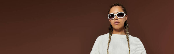 Stylish woman in elegant warm attire posing actively.