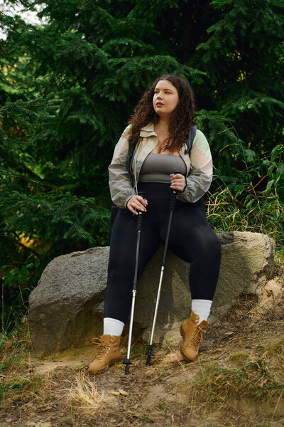 A confident plus size woman enjoys a peaceful moment in a lush green forest amidures beauty.