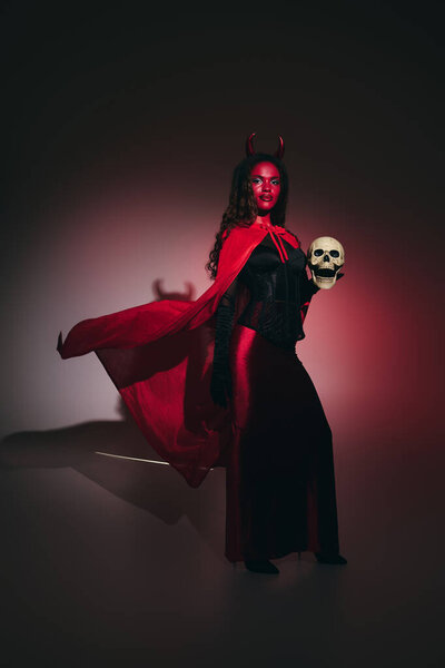 This captivating figure in a bright costume radiates confidence at Halloween celebrations.