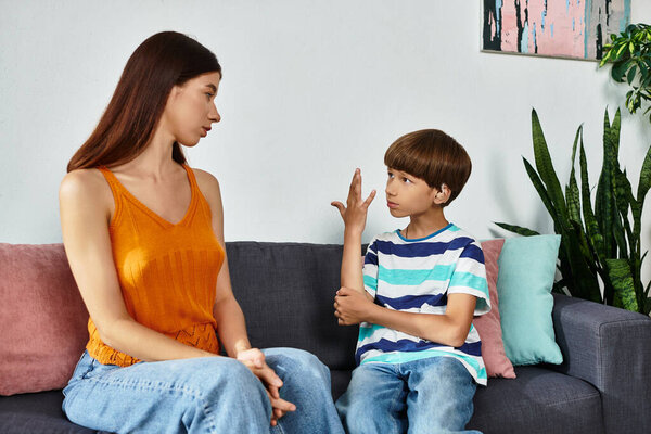 A mother and her young son with hearing impairment engage in a meaningful conversation.