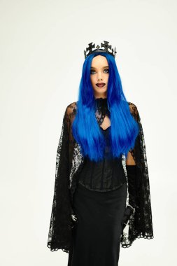 This beautiful young woman showcases an enchanting Halloween costume featuring bold blue hair. clipart