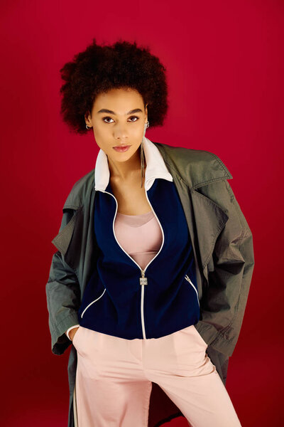 A young woman shows various emotions in modern fashion against a striking backdrop.