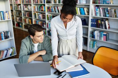 A passionate educator helps her young student understand concepts while studying together. clipart