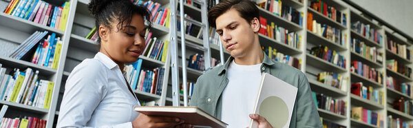 A passionate educator assists her young pupil with exploring academic materials in a library.