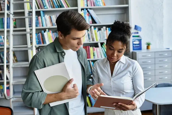 stock image A dedicated teacher shares knowledge with a young student in a vibrant library, encouraging growth.