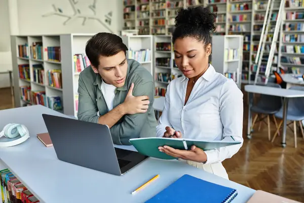 stock image A teacher guides her student through a learning experience, promoting curiosity and understanding.