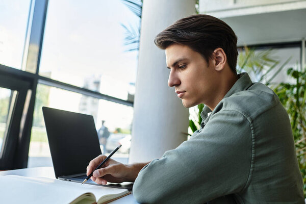 A thoughtful student learning in a vibrant classroom setting.
