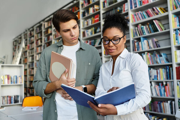 A passionate educator helps her student explore new knowledge in a library filled with books.