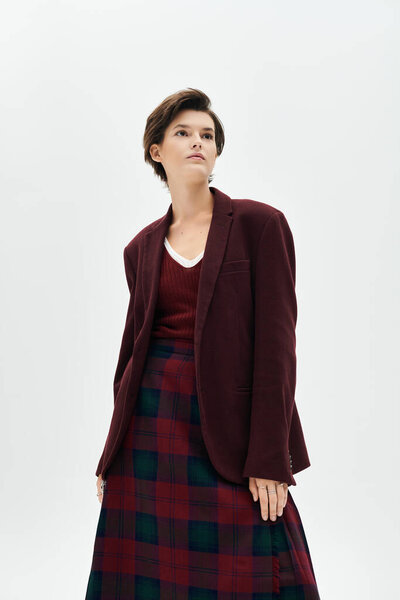 A stunning woman showcases her chic winter style in cozy layers, radiating confidence and elegance.