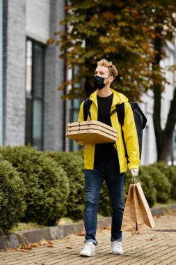 A delivery man in a black mask carries multiple food orders to the office, navigating the urban landscape.