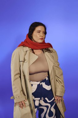 A confident plus size woman flaunts trendy fashion against a vibrant backdrop. clipart