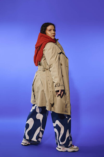 A plus size woman exudes confidence while modeling stylish streetwear with flair and attitude.