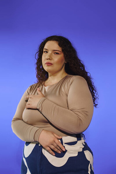 A stunning plus size woman stands gracefully, showcasing her beauty with a self assured expression.