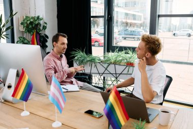 A charming couple engages in a meaningful conversation in a vibrant workspace. clipart