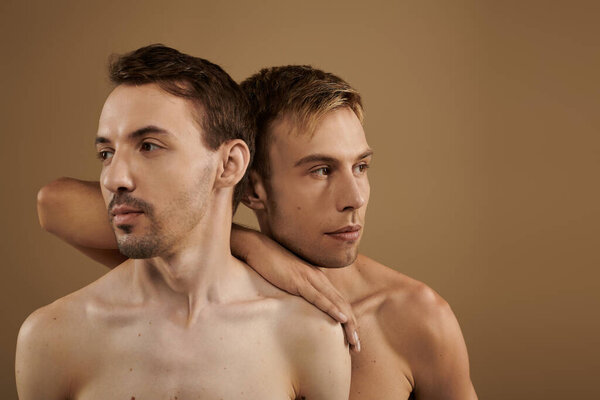 A heartfelt moment shared between two young men, showcasing their intimacy and connection.