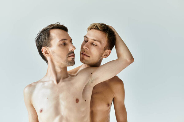 Two young men share an intimate embrace, showcasing their love and connection in a calm setting.