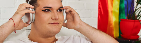 Listening to music with headphones, this person embraces their unique style and identity.