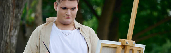 A unique individual expresses creativity while painting outdoors in a lush, vibrant environment.