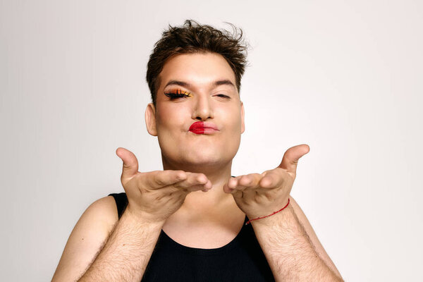 A captivating individual with striking makeup showcases self expression and confidence.