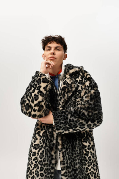 Handsome man poses thoughtfully, showcasing his bold fashion choice in a chic setting.