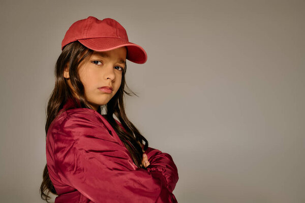 Young girl exudes confidence while dressed in festive attire, capturing holiday joy in 2025.