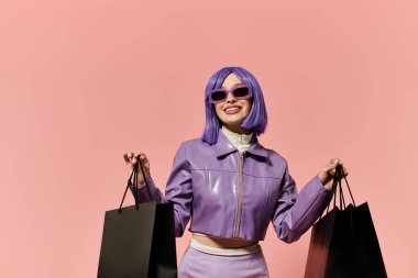 A vibrant woman with a purple wig smiles joyfully while holding shopping bags. clipart