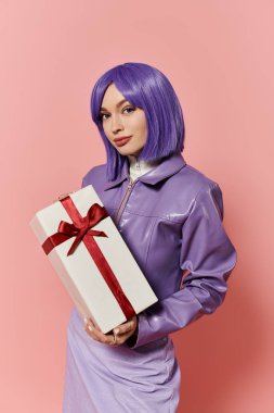 Woman with vibrant purple hair poses confidently with a gift box tied in a red ribbon. clipart