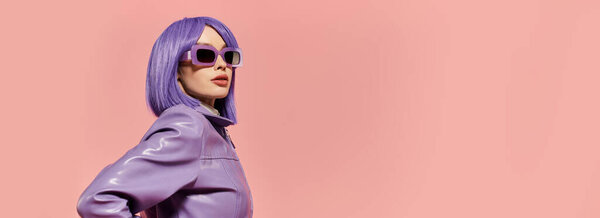 A stylish woman with purple hair poses confidently in trendy sunglasses and attire.