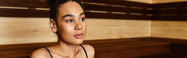 Relaxation takes center stage as a young african american woman enjoys her spa experience.