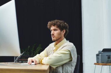 A curly-haired young man in a sweater vest is focused on his work in a corporate office. clipart