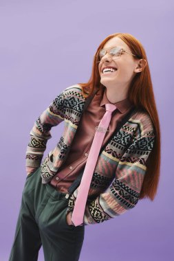 A young queer man with long red hair smiles in a trendy outfit against a pastel background. clipart