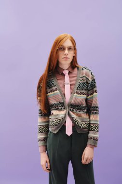 A young queer individual with striking red hair presents a fashionable look in a vibrant setting. clipart