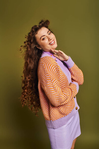 A young woman showcases her trendy outfit with a bright smile, enhancing the lively atmosphere.