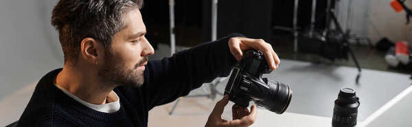 Focused individual skillfully adjusts camera settings in a contemporary photography studio.