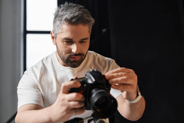 A focused photographer adjusts camera settings in a bright studio, ready to capture stunning images.