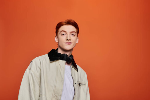 Handsome young man with a charming smile stands confidently, showcasing his emotional depth.