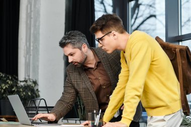 Two professionals engage in onboarding activities at a contemporary workspace, sharing insights. clipart