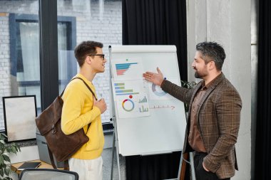 A new employee listens attentively during an onboarding session while discussing important data. clipart