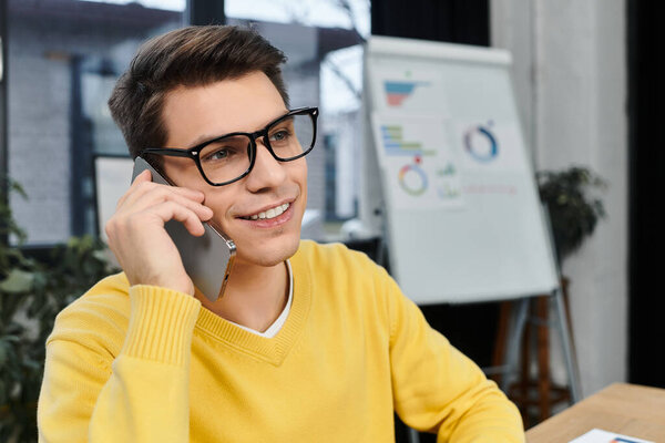 New employee smiles while talking on the phone, embracing the excitement of their first day at work.