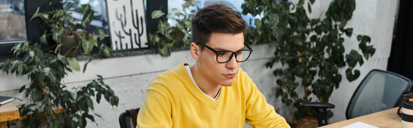 Newcomer finishes onboarding tasks in a bright, plant filled office.