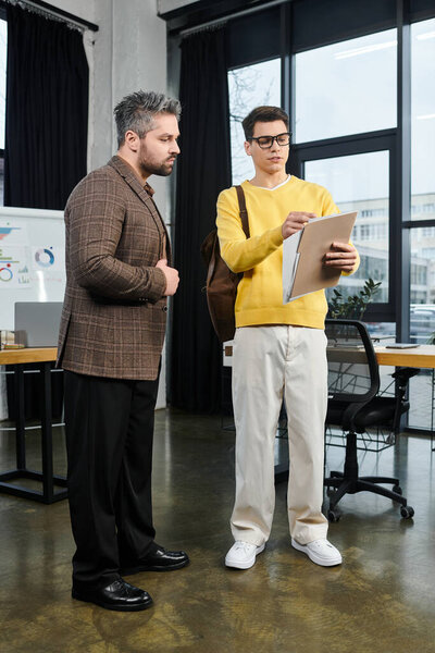 New employee interacts with a mentor, exploring tasks and responsibilities on their inaugural day.