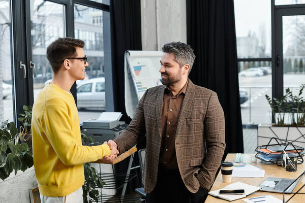 Two professionals engage in a warm handshake, celebrating a successful onboarding process together.