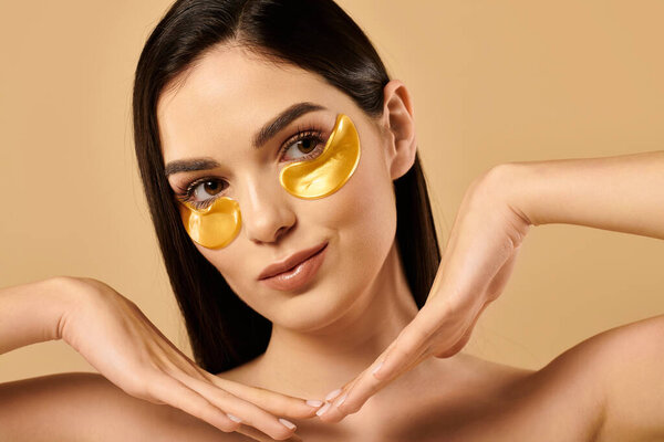 A young woman with glowing skin poses gracefully, highlighting her beauty routine and self-care.