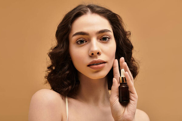 Pretty young woman with braces demonstrates her skincare routine in a modern studio.