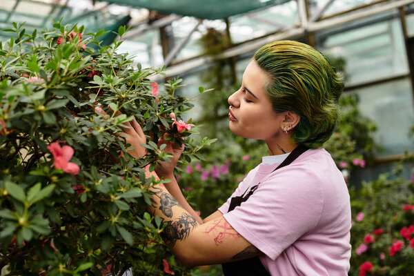 A skilled young woman tends to vibrant flowers in a lively greenhouse full of greenery.