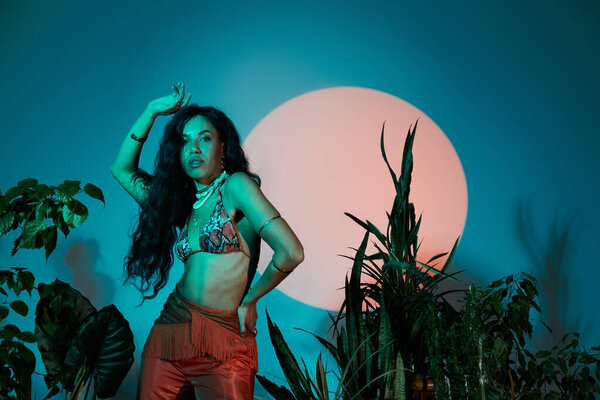 Young woman showcases vibrant summer fashion with a confident pose surrounded by plants.