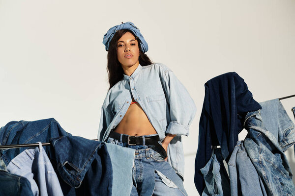 A confident woman flaunts her unique summer denim style with trendy clothing around her.