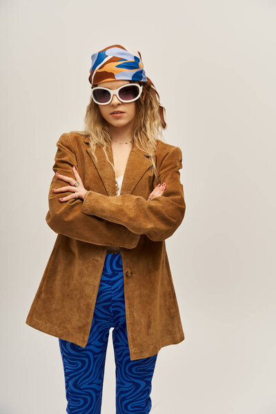 A beautiful young woman showcases her unique style while posing confidently.