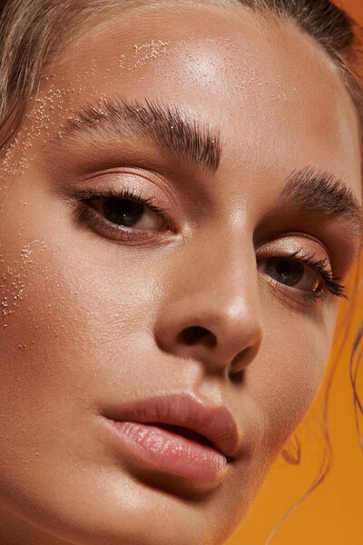 A young woman displays her summer beauty with natural makeup