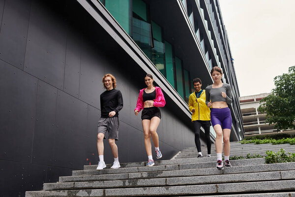 Energetic youth in athletic gear race down steps, enjoying a sporty day outdoors.